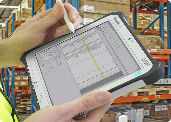 Handheld tablet showing a waste-tracking report in a warehouse